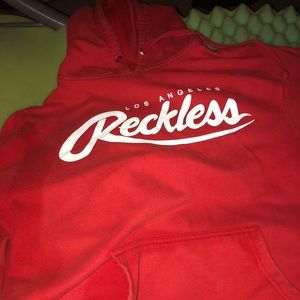 Young and reckless sweater